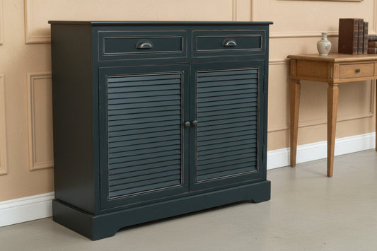 Dark blue cabinet with shutter doors against a wooden wall.